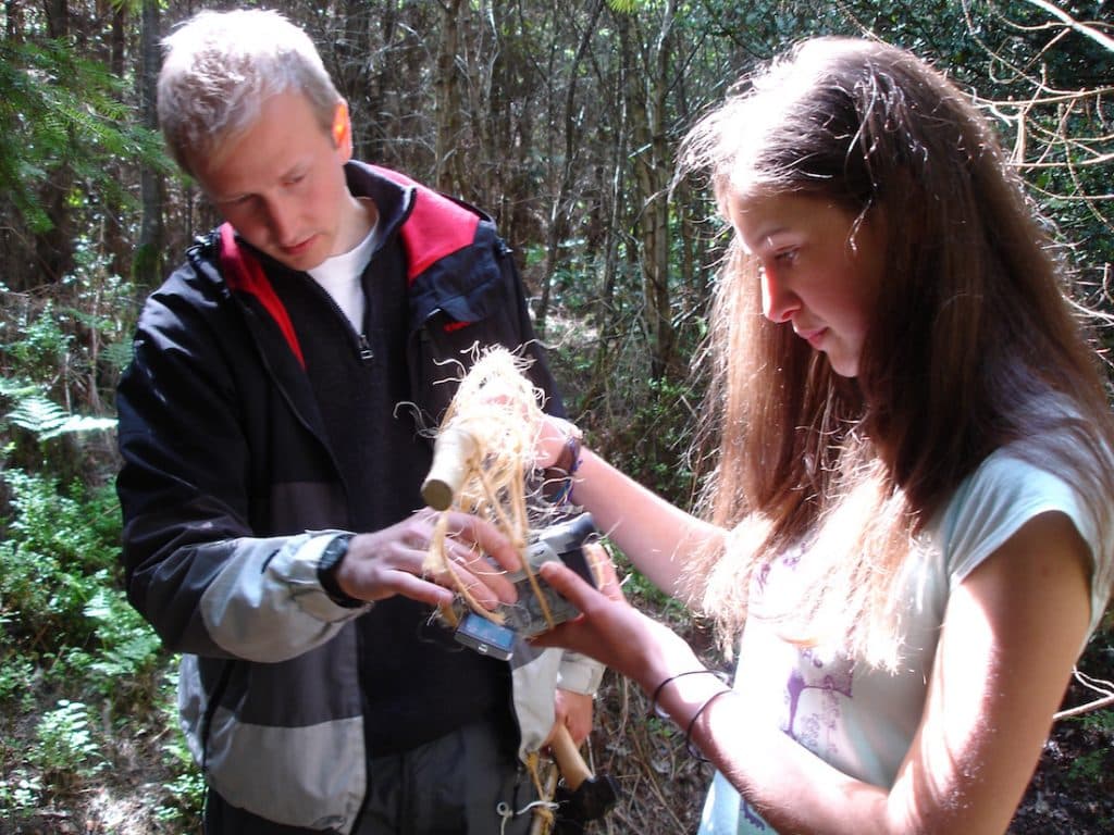Dan helping a teenage girl on a media workshop in Haldon Forest